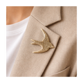 Broche hirondelle vernis doré à paillettes