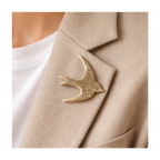 Broche hirondelle vernis doré à paillettes