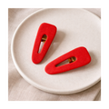 Barrettes rouges légèrement pailletées